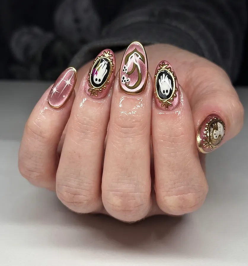 Sheer nude nails with framed portrait designs